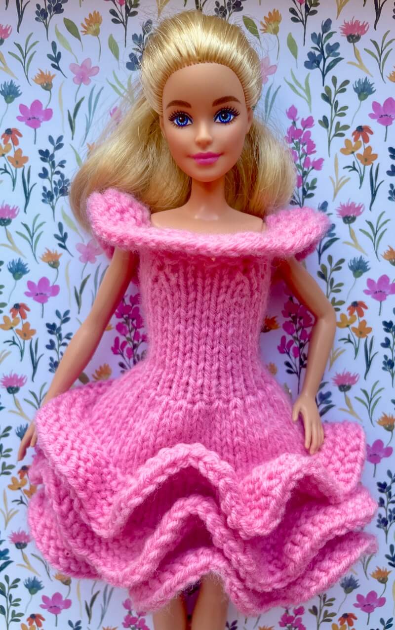 Barbie doll wearing 3 ruffle skirt dress knit with sirdar snuggly dk