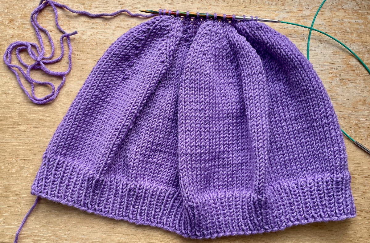 Adult size DK beanie hat after last row leaving 13 stitches leaving a long tail for gathering the top and seaming