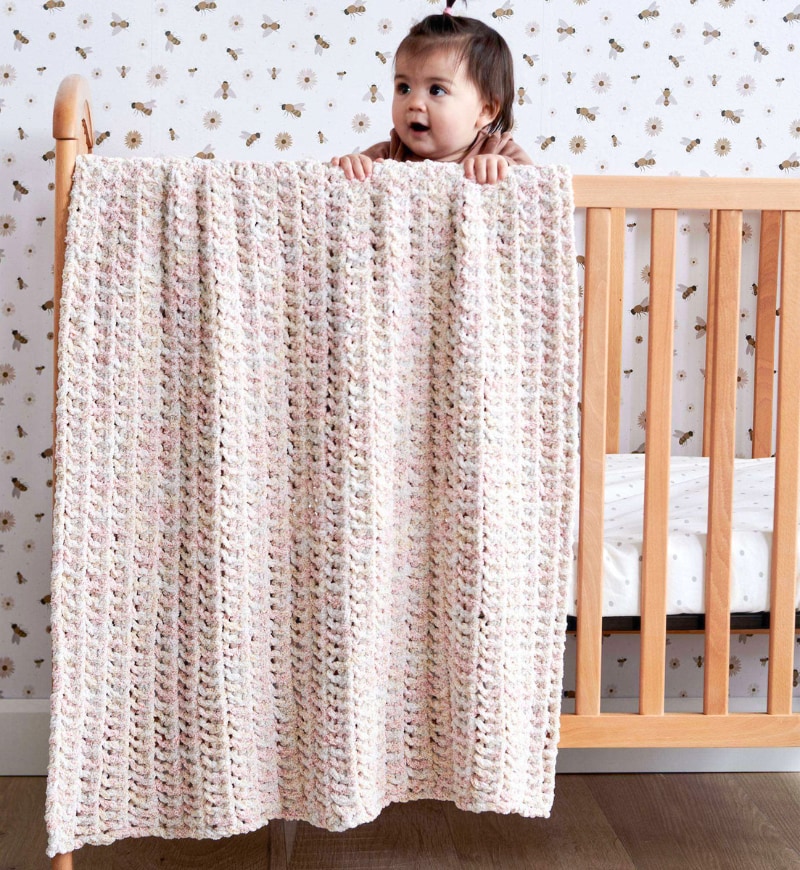 Easiest eyelet super bulky baby blanket knitting pattern by Bernat