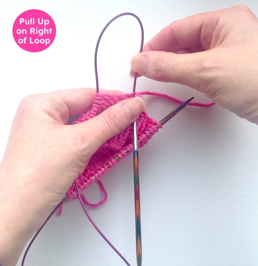 Pull up on the right hand side of the cable loop to move the 1st 4 stitches to the tip