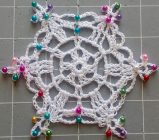 Blocking a crochet snowflake with lots of pins