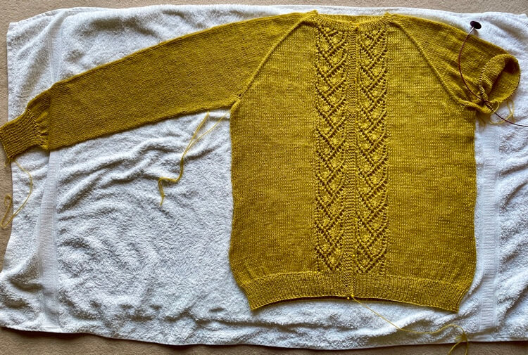 Blocked cardigan laid out to dry
