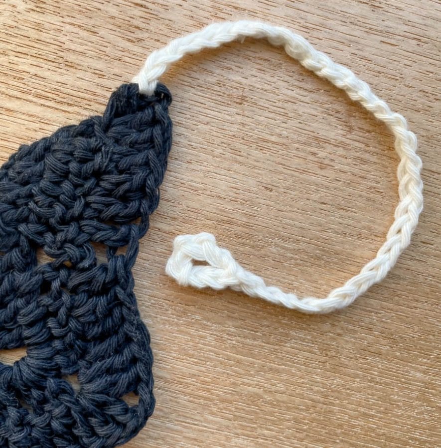 I chained 37 in cream yarn at each end of my bat bunting to hang it up with
