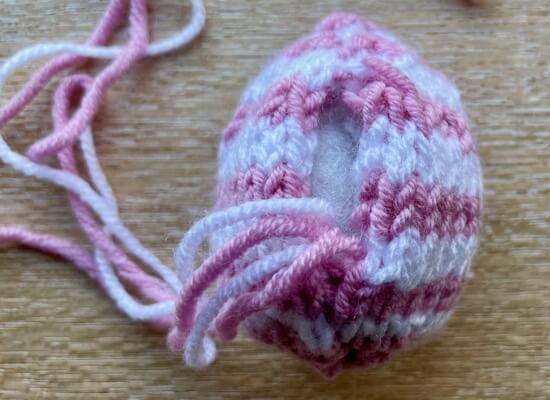 Back of stuffed egg with seam gap and loose yarn ends