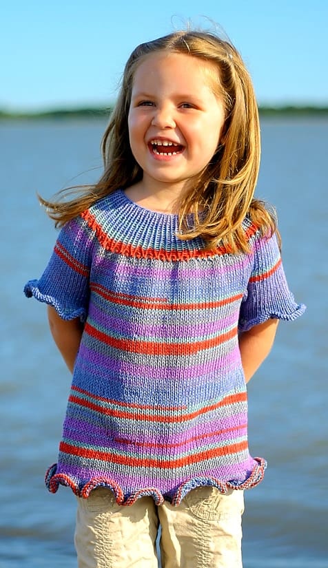 Little girl wearing multicoloured ruffle summer top free knitting pattern by Elena Nodel