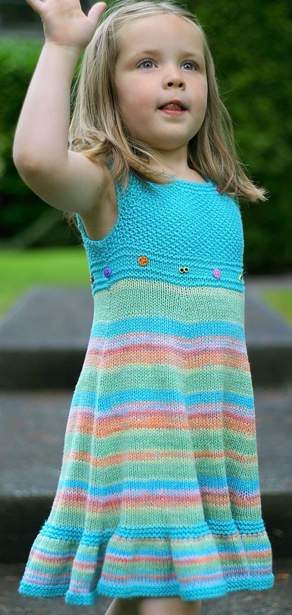 Young girl wearing shades of summer dress free knitting pattern by Elena Nodel