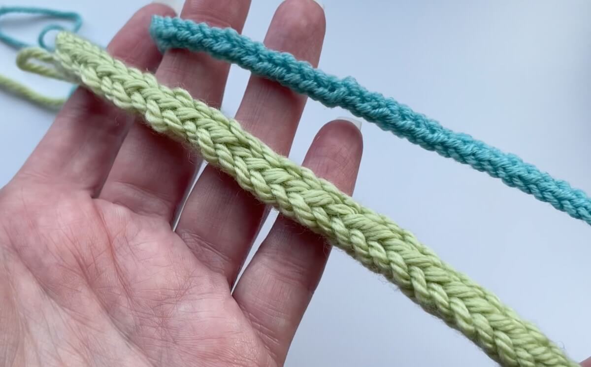 Thick and thin knit i-cord examples held in hand