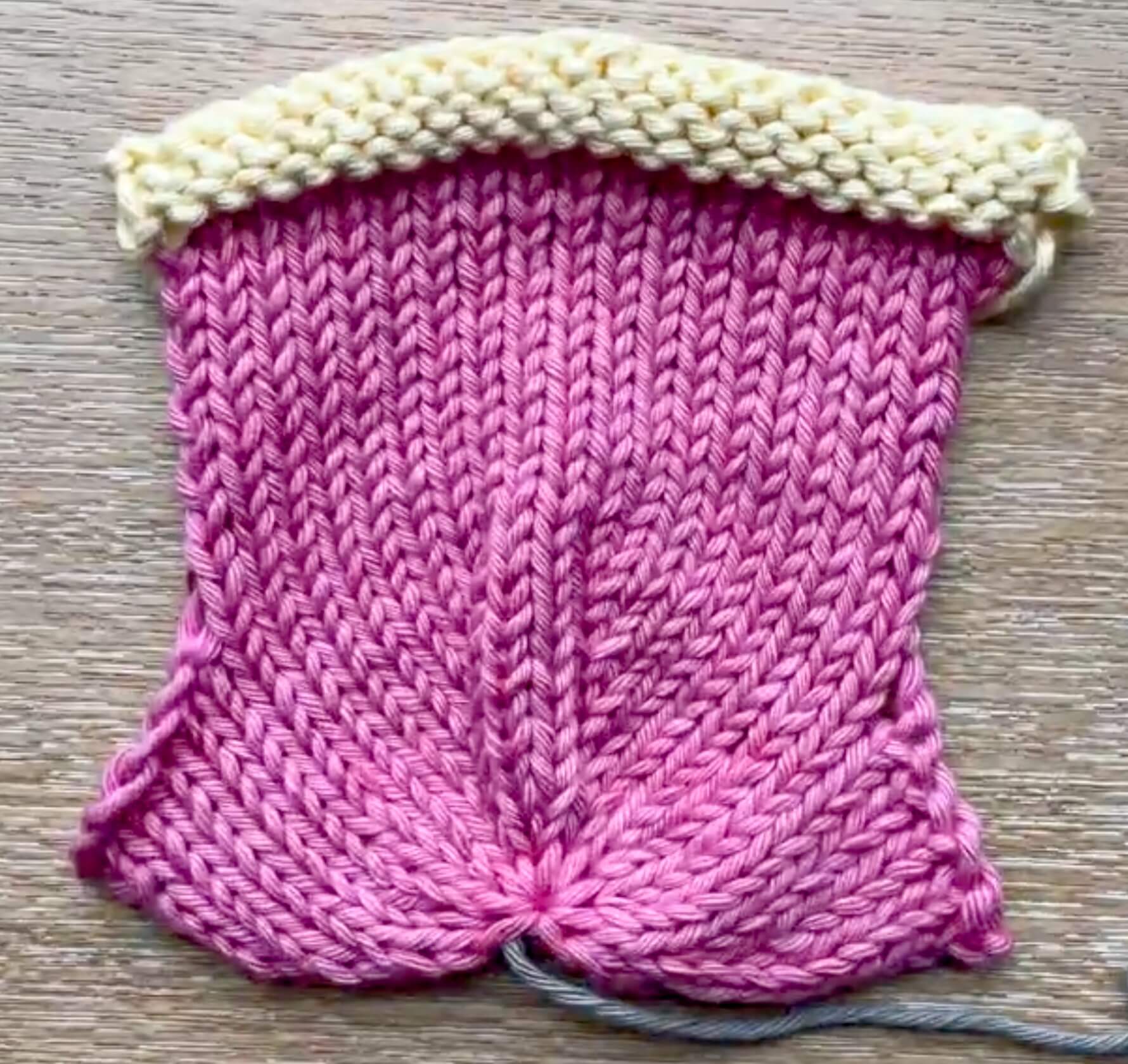 The finished knitted stocking piece before you seam it