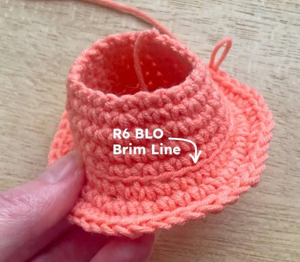 Labubu crochet bucket hat after round 8, with visible brim line from round 6 done in back loop only