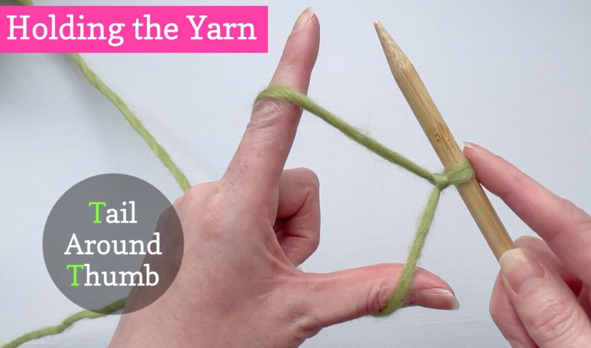 Make a L shape with your left hand and wrap the ball end around your finger and the tail around your thumb
