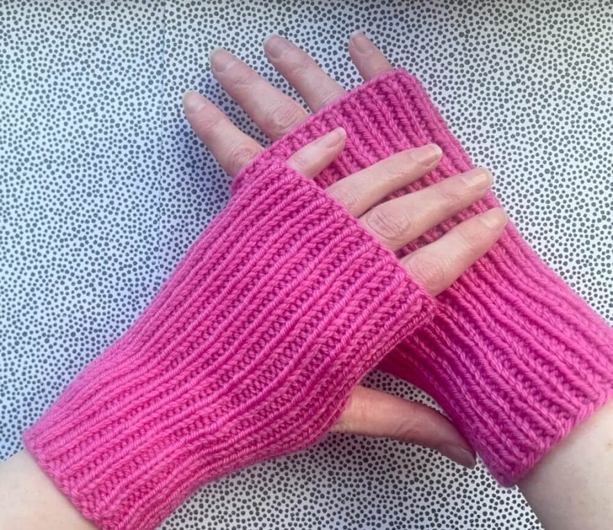 Easy knit ribbed mitts knit in pink Drops Daisy DK yarn