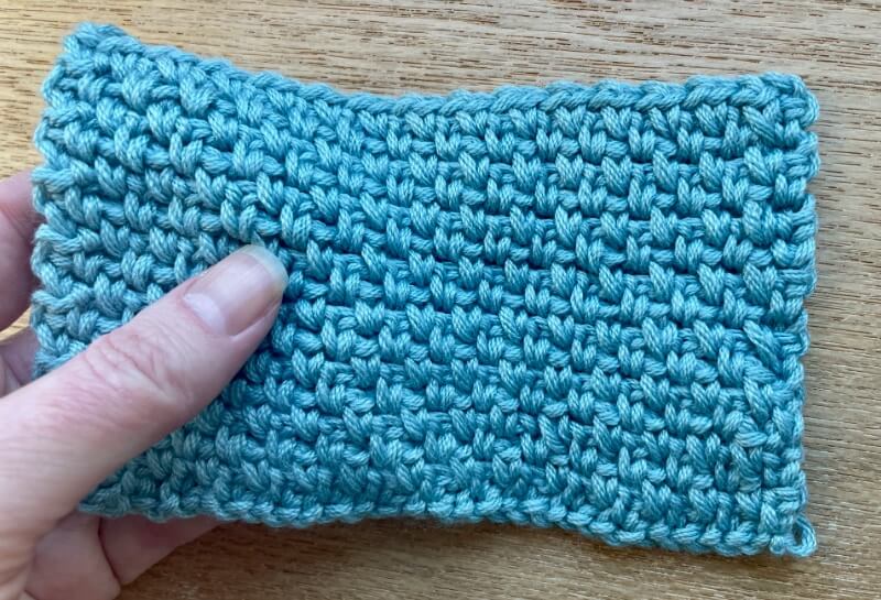 Crochet swatch of Sirdar No 1 DK after machine washing and drying