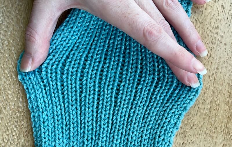 Close-up of stretching rib knit with Sirdar No 1 DK acrylic yarn