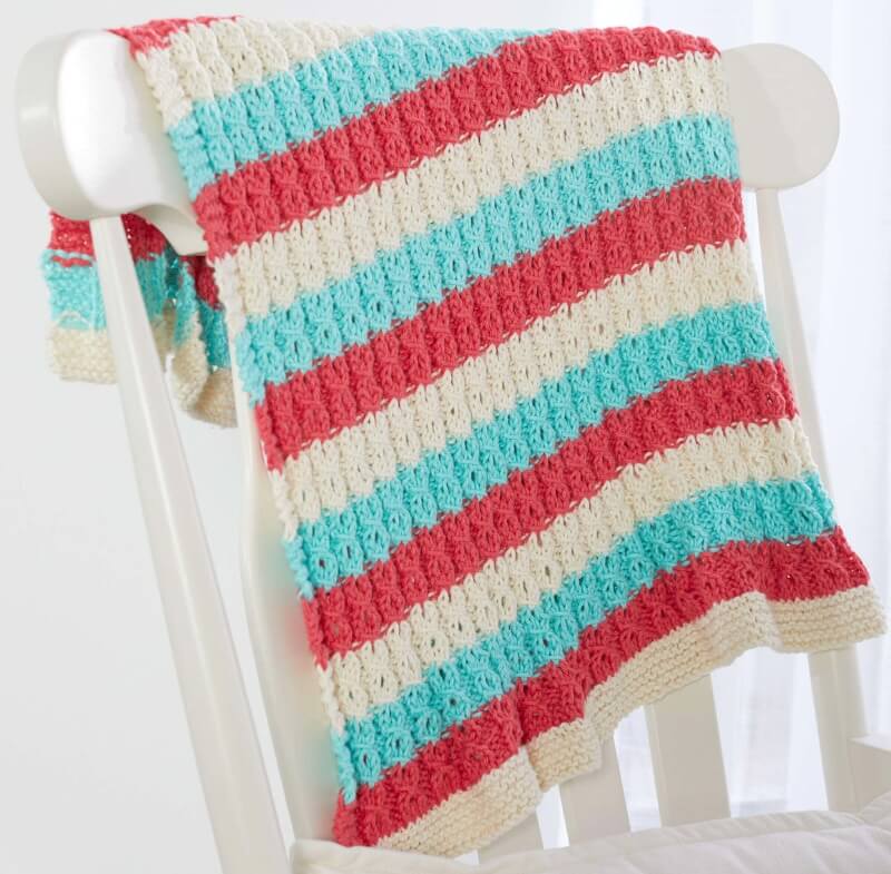 Free mock cable sweet and cosy baby blanket knitting pattern from yarnspirations
