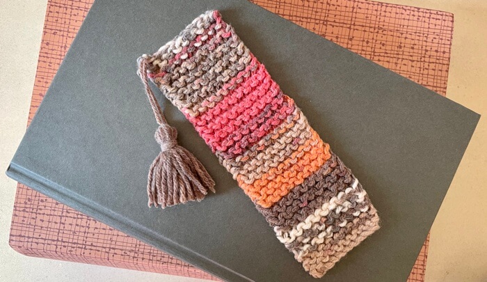 Garter stitch bookmark with tassel knit with variegated multicoloured DK yarn