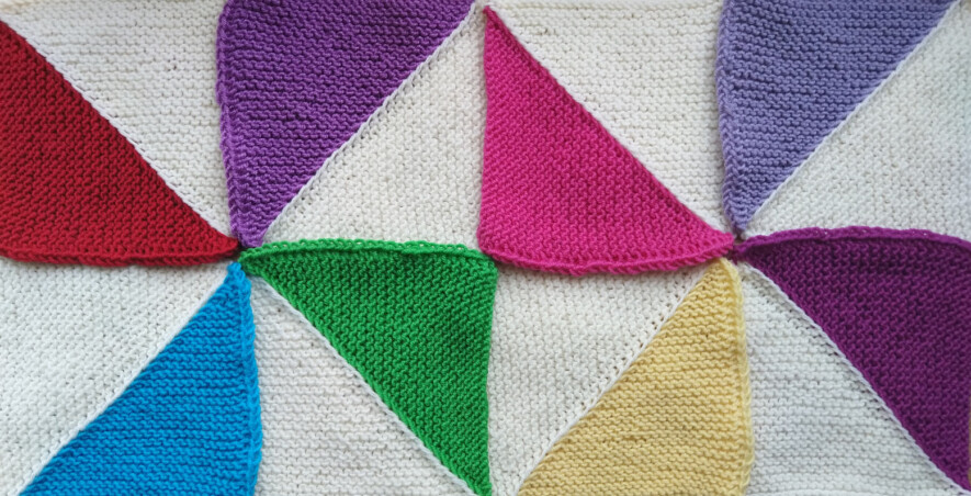 Multicoloured knitted triangle squares